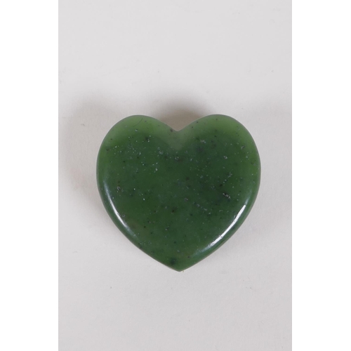 302 - A carved spinach jade heart shaped box and cover, 5 x 5cms