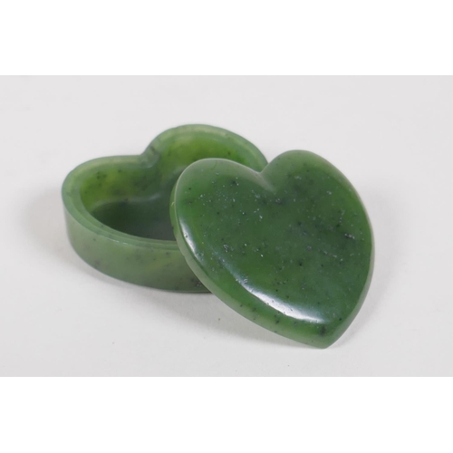 302 - A carved spinach jade heart shaped box and cover, 5 x 5cms