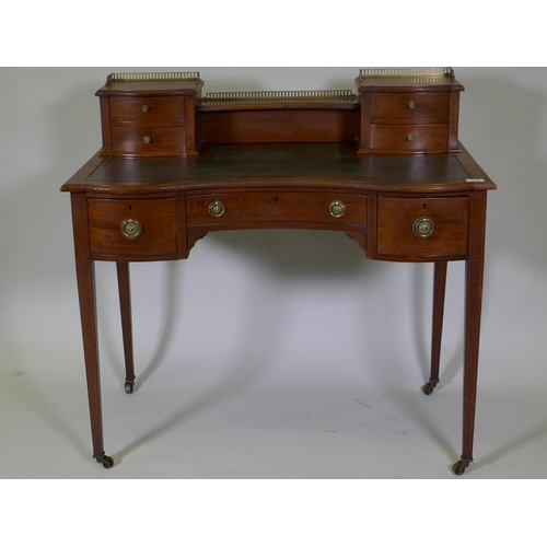 1138 - A Victorian inlaid mahogany bonheur de jour, the upper section with pierced brass gallery over four ... 