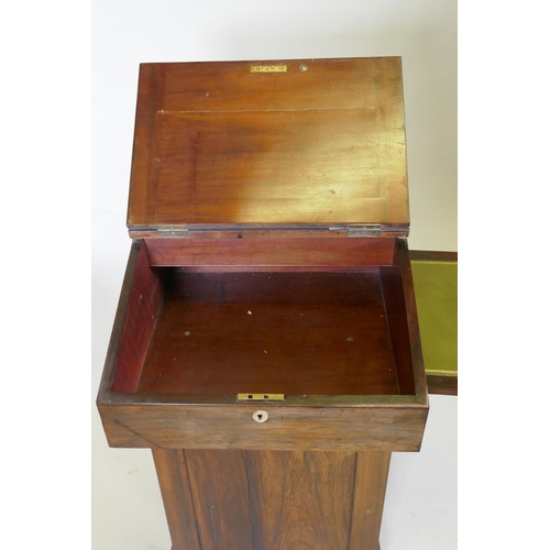 1022 - A Victorian rosewood davenport desk, with three quarter gallery and covered inkwell compartment, sli... 