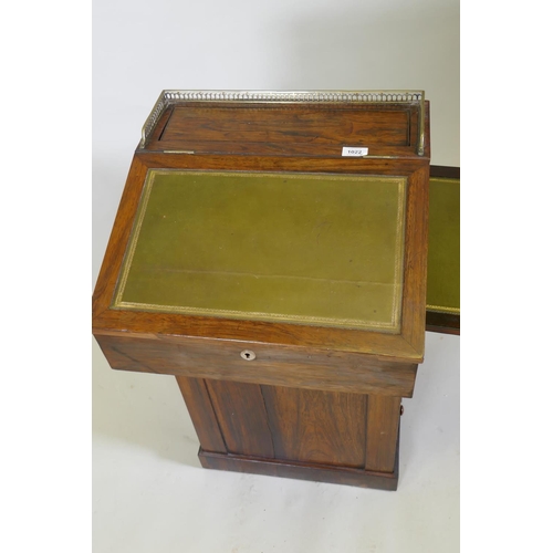 1022 - A Victorian rosewood davenport desk, with three quarter gallery and covered inkwell compartment, sli... 