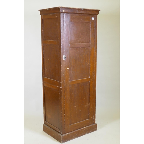 1027 - A late C19th/early C20th grain painted cupboard with panelled sides and door, rope twist carved top ... 