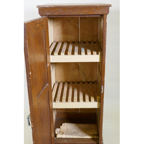 1028 - A late C19th/early C20th grain painted cupboard with panelled sides and door, rope twist carved top ... 