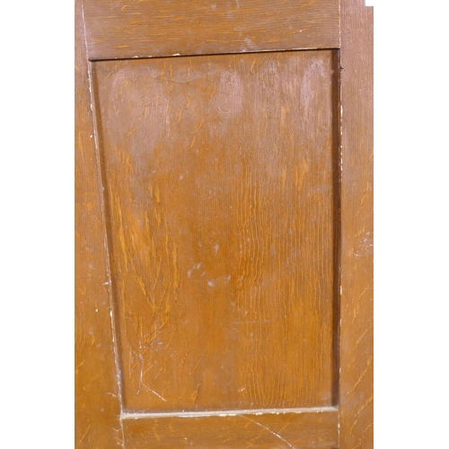 1028 - A late C19th/early C20th grain painted cupboard with panelled sides and door, rope twist carved top ... 