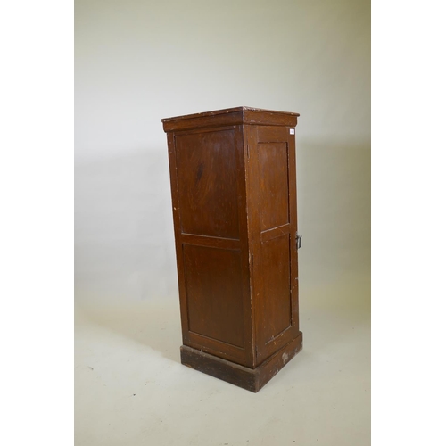 1028 - A late C19th/early C20th grain painted cupboard with panelled sides and door, rope twist carved top ... 