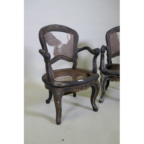 1033 - A pair of C18th/C19th child's elbow chairs with lacquered and carved parcel gilt decoration, possibl... 