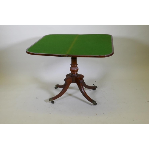 1034 - A Regency rosewood card table with satinwood inlaid borders, fold over top and inlaid frieze, raised... 