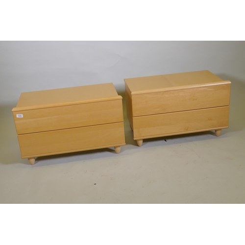 1035 - A pair of Hulsta contemporary beechwood veneered bed side chests, with two soft close drawers, raise... 