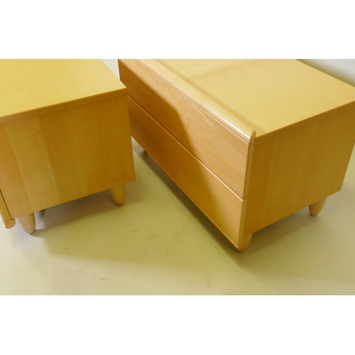 1035 - A pair of Hulsta contemporary beechwood veneered bed side chests, with two soft close drawers, raise... 