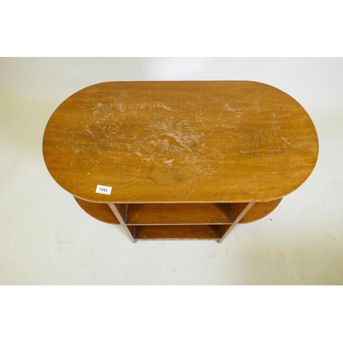 1042 - An Art Deco oak open bookcase/display table in the manner of Heals, 77 x 38 x 60cm