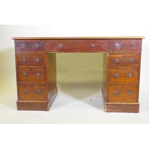 1043 - A Victorian mahogany nine drawer pedestal desk with gilt tooled leather inset top and ring pull hand... 