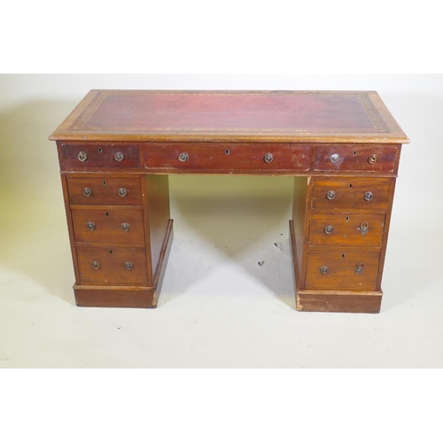 1043 - A Victorian mahogany nine drawer pedestal desk with gilt tooled leather inset top and ring pull hand... 