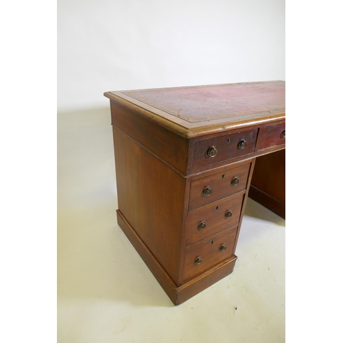 1043 - A Victorian mahogany nine drawer pedestal desk with gilt tooled leather inset top and ring pull hand... 