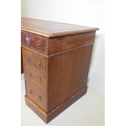 1043 - A Victorian mahogany nine drawer pedestal desk with gilt tooled leather inset top and ring pull hand... 