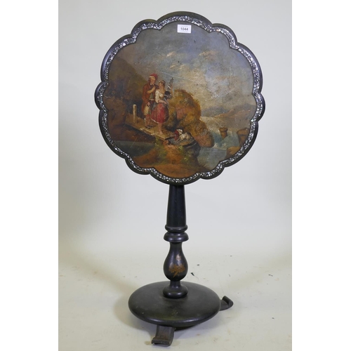 1044 - A Victorian papier mache tilt top occasional table, the shaped top with Mother of Pearl inlaid borde... 