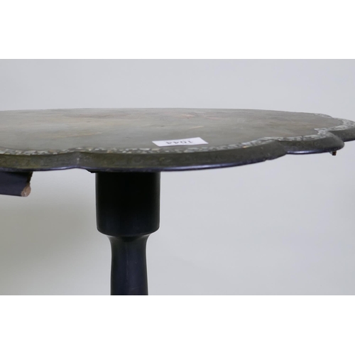 1044 - A Victorian papier mache tilt top occasional table, the shaped top with Mother of Pearl inlaid borde... 