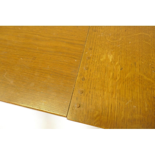 1046 - A bespoke Arts & Crafts style oak refectory table with cleated end plank top raised on square su... 