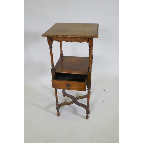 1049 - A Georgian style oak night stand with shaped top and single drawer to undertier, raised on turned su... 