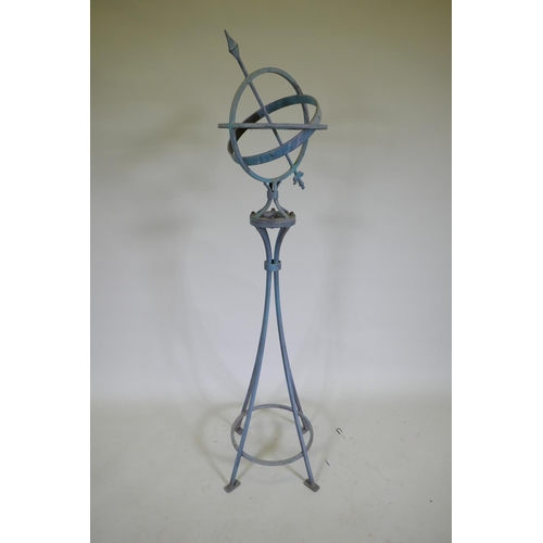 1050 - A patinated wrought metal armillary with bronze chapter ring, 150cm high