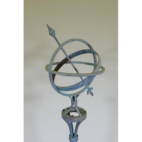 1050 - A patinated wrought metal armillary with bronze chapter ring, 150cm high