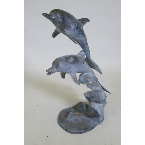 1051 - A bronze fountain in the form of two leaping dolphins, 80cm high