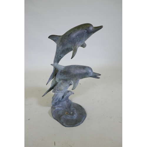 1051 - A bronze fountain in the form of two leaping dolphins, 80cm high