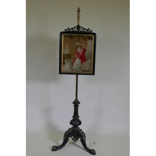 1053 - A C19th adjustable pole screen, the ebonised frame with open fretwork crest housing a Regency silk e... 