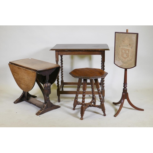 1056 - An oak drop leaf occasional table, raised on carved end supports united by a shaped stretcher, 68 x ... 