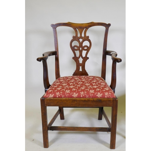 1057 - An C18th Chippendale style walnut chair with pierced splat back, raised on square supports and later... 