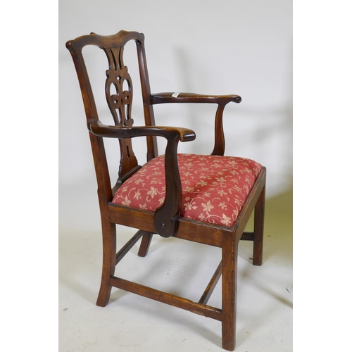 1057 - An C18th Chippendale style walnut chair with pierced splat back, raised on square supports and later... 