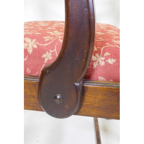 1057 - An C18th Chippendale style walnut chair with pierced splat back, raised on square supports and later... 