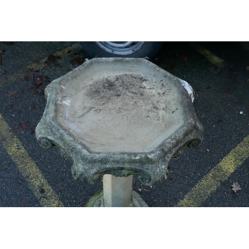 1062 - A reconstituted stone bird bath, 90cm high, 54cm diameter, AF