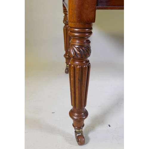 1068 - A Victorian mahogany wind-out dining table, moulded edge top and two extra leaves, raised on carved ... 