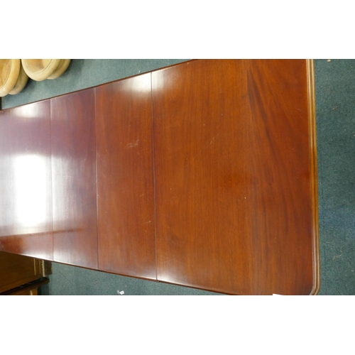 1068 - A Victorian mahogany wind-out dining table, moulded edge top and two extra leaves, raised on carved ... 