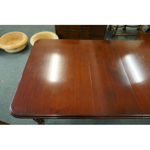 1068 - A Victorian mahogany wind-out dining table, moulded edge top and two extra leaves, raised on carved ... 