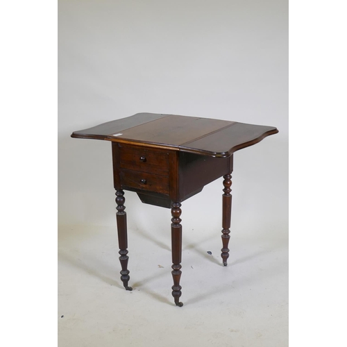 1073 - A William IV rosewood workbox, with shaped drop flaps, two drawers and pull out well, raised on turn... 