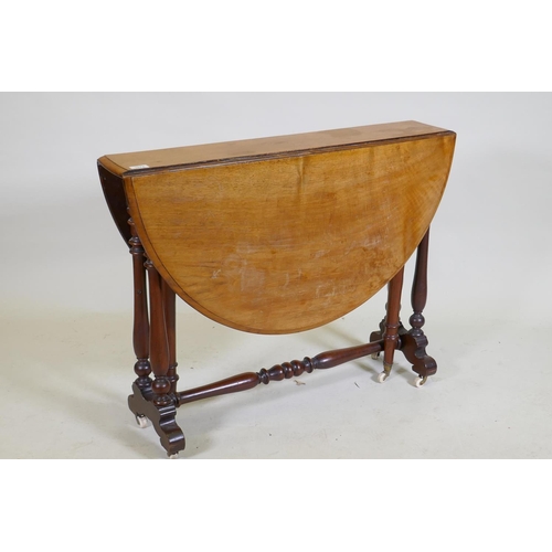 1074 - A Victorian walnut Sutherland table with turned supports and centre stretcher, 104 x 89 x 70cm