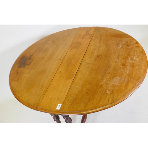 1074 - A Victorian walnut Sutherland table with turned supports and centre stretcher, 104 x 89 x 70cm