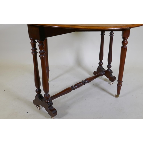 1074 - A Victorian walnut Sutherland table with turned supports and centre stretcher, 104 x 89 x 70cm