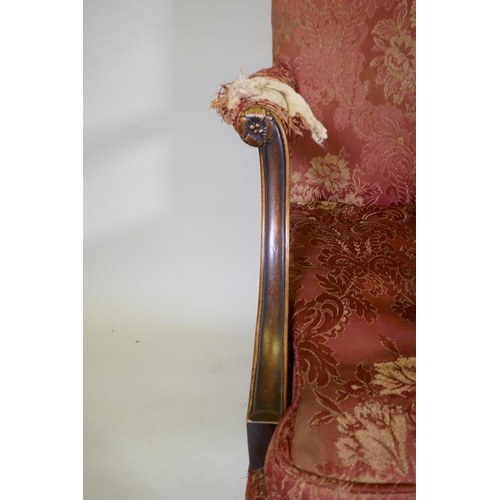 1077 - A late C19th Gainsborough chair with hump back, scroll arms, carved cabriole legs and ball and claw ... 