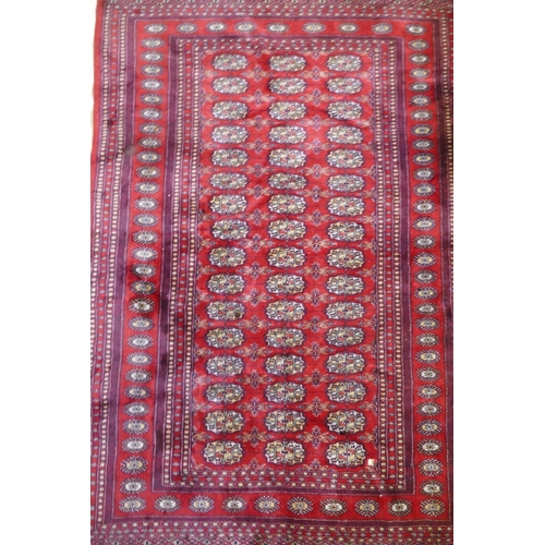 1078 - A fine woven red ground wool Bokharra rug, AF, 128 x 190cm