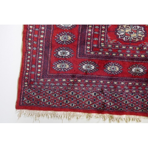 1078 - A fine woven red ground wool Bokharra rug, AF, 128 x 190cm