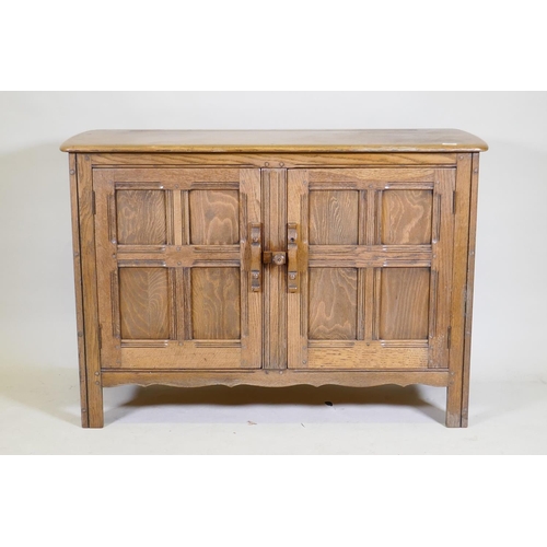 1082 - An Ercol 'Old Colonial' elm two door buffet, 122 x 45cm, 84cm high