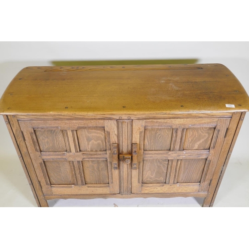 1082 - An Ercol 'Old Colonial' elm two door buffet, 122 x 45cm, 84cm high