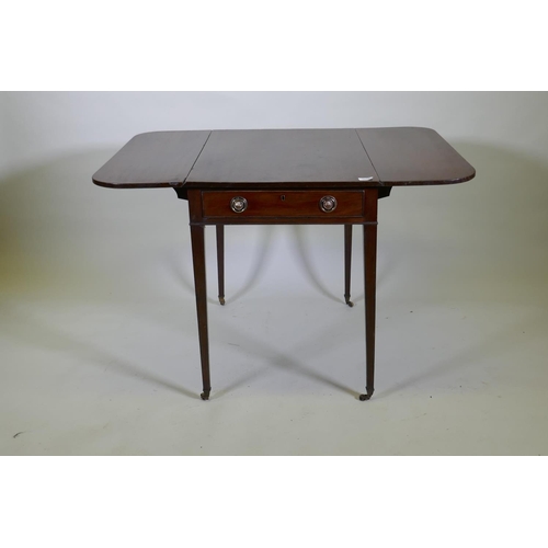 1088 - A Georgian mahogany pembroke table with single end drawer, raised on square tapering supports with b... 