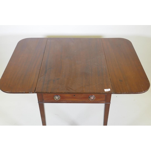 1088 - A Georgian mahogany pembroke table with single end drawer, raised on square tapering supports with b... 