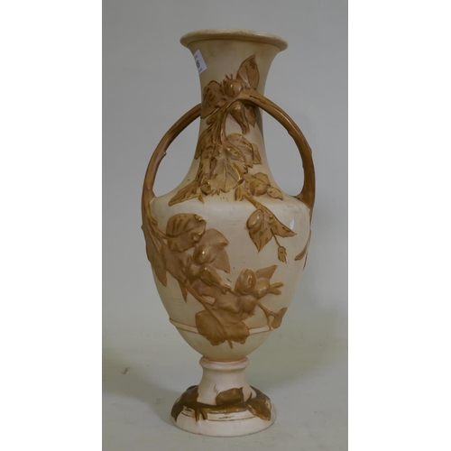 109 - A Royal Dux two handled amphora vase, with raised floral parcel gilt decoration on a buff glaze, mar... 