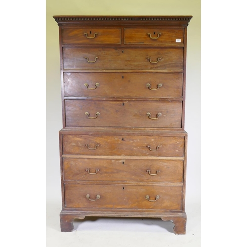 1092 - A George III mahogany chest on chest, the upper section with dentil cornice over two + three drawers... 