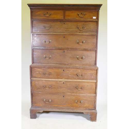 1092 - A George III mahogany chest on chest, the upper section with dentil cornice over two + three drawers... 