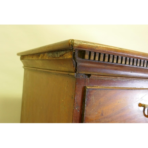 1092 - A George III mahogany chest on chest, the upper section with dentil cornice over two + three drawers... 